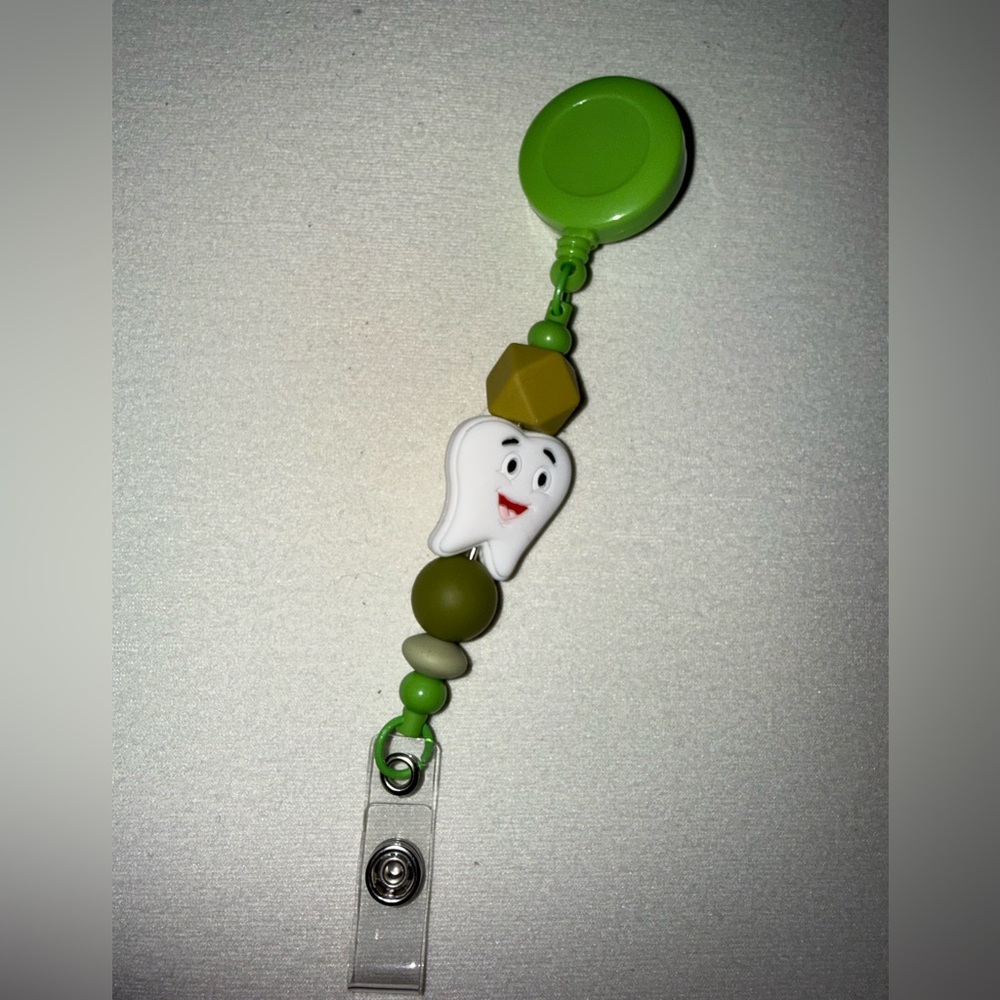Handcrafted Green and White Tooth Badge Reel
